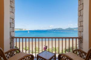 a balcony with a view of the ocean at Methoni Beach Hotel in Methoni