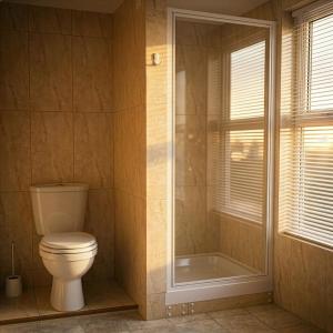a bathroom with a toilet and a shower at Trevellis Bed and Breakfast in Newquay +32 photos