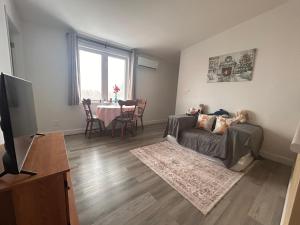 a living room with a couch and a table at Bridge View near Confederation Bridge and beaches in Borden-Carleton