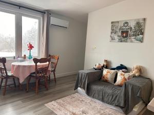 a living room with a couch and a table at Bridge View near Confederation Bridge and beaches in Borden-Carleton