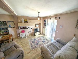 a living room with a couch and a table at Casa Bellavista in Montefegatesi +22 photos