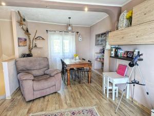 a living room with a chair and a table at Casa Bellavista in Montefegatesi