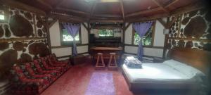 a living room with a couch and a table at Bosque de Oro in Apía