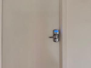 an open door with a lock on it at Qt inntouch in Queenstown