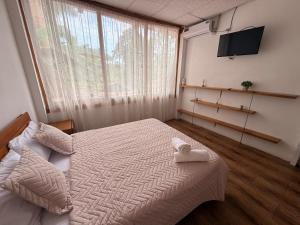 a bedroom with a bed and a large window at ROOM COLIBRÍ - La Casa de Eros in Ayampe +29 photos