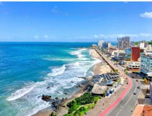 an aerial view of a beach with buildings and the ocean at VISTA MAR SPOT Barra in Salvador