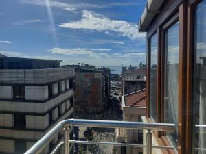 a balcony with a view of a city at The Best City Kadikoy in Istanbul