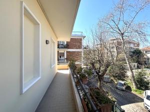 an empty balcony of a house with a window at Casa Melina - Pesaro Mare in Pesaro