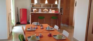 a kitchen with a table with dishes on it at Sweet holidays in Matera