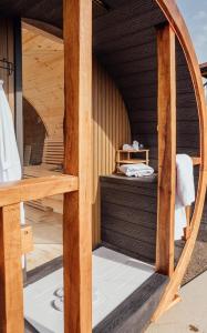 a wooden sauna with a round window in a building at Peaceful home in Moorside