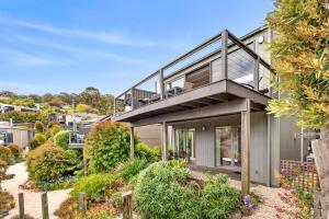 an image of a house with a balcony at Breakers Holiday House in Lorne