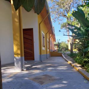 a building with a door on the side of it at Recanto do Ipê in Extrema