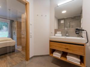 a bathroom with a sink and a shower at Pinzgau Lodge 2B in Wald im Pinzgau +46 photos