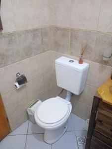 a bathroom with a white toilet and a sink at ¡Quien Diria! in San Clemente del Tuyú +51 photos
