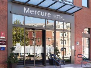 a mercure hotel sign on the front of a building at Mercure Arras Centre Gare in Arras