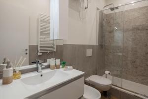 a bathroom with a sink and a toilet and a shower at LEO'S HOME in La Spezia +16 photos