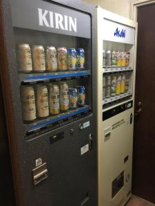 a vending machine filled with cans of beer at Hotel Crown Hills Matsuyama in Matsuyama