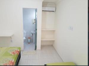 a bathroom with a shower and a toilet in a room at 14km de tambau in Cabedelo