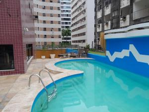 a swimming pool in the middle of a building at FLAT SAINT MARTIN Apto 308 in Fortaleza