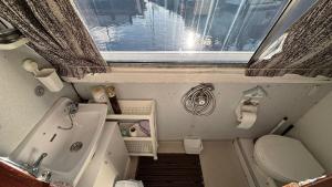 a small bathroom with a sink and a toilet at Hidden gem in Invernisk