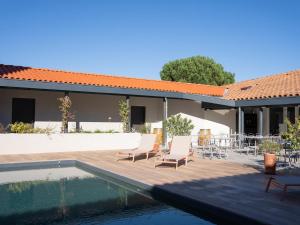 a patio with chairs and a swimming pool in a house at ibis Montauban in Montauban
