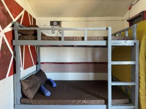 two bunk beds in a small room at INS n OUTZ in Bolinao