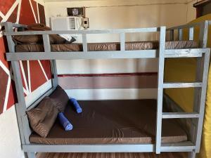 a couple of bunk beds in a room at INS n OUTZ in Bolinao