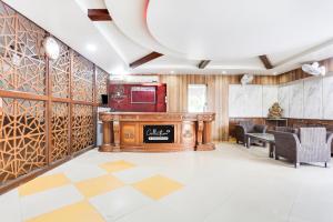 a lobby with a bar with a checkered floor at Collection O Bhiwadi in Bhiwadi