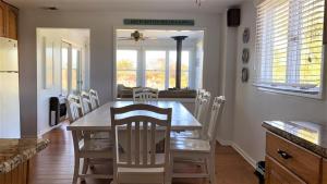 a kitchen and dining room with a table and chairs at 324 First Ave in West Cape May