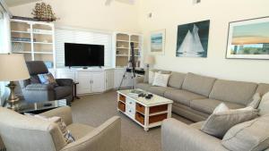 a living room with couches and a flat screen tv at 324 First Ave in West Cape May