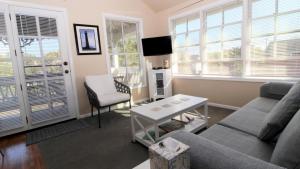 a living room with a couch and a table at 202 Ocean Unit 6 in Cape May Point