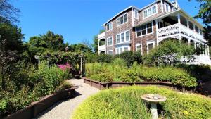 a house with a garden in front of it at 202 Ocean Unit 6 in Cape May Point