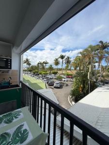 a balcony with a view of a parking lot at Kéloué in Saint-François