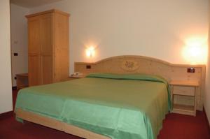 Voodi või voodid majutusasutuse Hotel Tosa toas