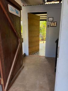 an open door to a room with a hallway with a door at Studio VAI in HUH