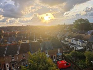 a view of a city with houses and a red car at Ramsgate Sea-side Stay! in Ramsgate
