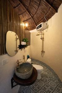 a bathroom with a sink and a toilet at Sora Traditional Homestay in Ninh Binh +74 photos