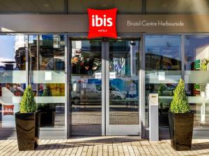 an entrance to a building with a sign on the door at ibis Bristol Centre in Bristol