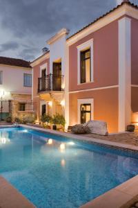 a large swimming pool in front of a house at Αρχοντικό Ταξίμι - Ανθέων Έμπνευση in Argalasti