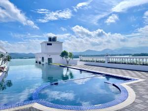a swimming pool on the roof of a building at Belliss Hotel Đại Lải in Phúc Yên