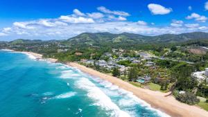 an aerial view of a beach with houses at Nautilus Beach Resort by Charlesworth in Coffs Harbour