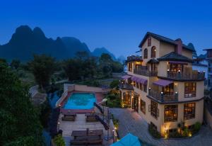 an aerial view of a house with a swimming pool at YangShuo Coco Garden Villa-Western food&English Guide in Yangshuo