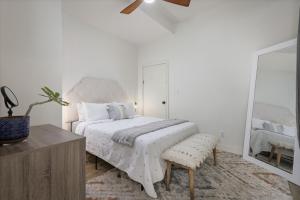 a bedroom with a large bed and a mirror at Quiet 2BR Kona Retreat Beach Gear BBQ Patio in Kailua-Kona +31 photos