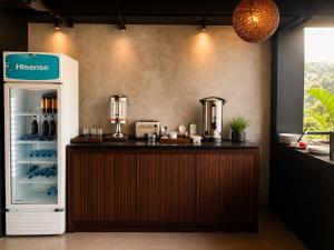a kitchen with a counter and a refrigerator at Monaara Leisure - Ella in Ella
