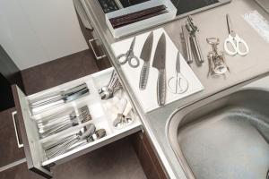 a kitchen counter with utensils and a sink at 民泊-天- in Beppu +28 photos