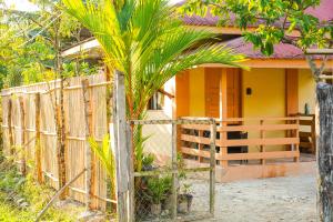 a house with a fence in front of it at Aman House in San Vicente
