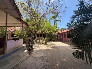 a courtyard of a building with trees and houses at Harmony - Havelock Island in Havelock Island +18 photos