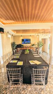 a large table in a room with chairs at Castle View Hotel Samal in Magamomo +180 photos