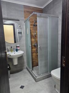 a bathroom with a shower and a sink and a toilet at Happy Stay Hotel in Kutaisi +51 photos