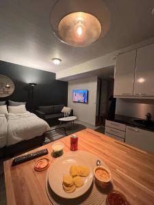 a room with a table with a plate of food on it at Top location in Joensuu in Joensuu